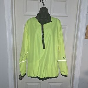 Nike quarter zip large windbreaker has reflecter stripes